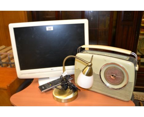 A Toshiba flatscreen TV, Roberts Radio and a desk-lamp