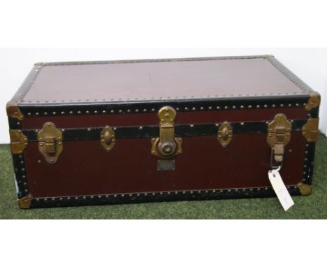 A large bound trunk with mounts and corners, with fitted tray