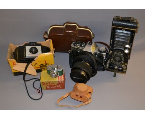 Zeiss movinette 8B (boxed) olympus CM20 camera, Kodak brownie 27 camera and madison baby camera along with a camera tripod