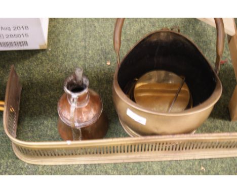 A large brass coal-scuttle, a brass fender, a copper jug and a set of brass Salter wall-mounting scales