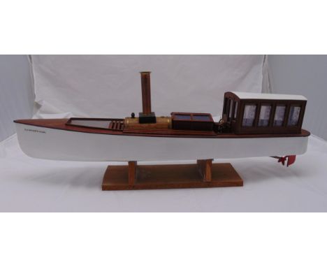 A scale model steam engine sailing boat titled Christina with glazed cabin and copper funnel on wooden stand, 96 x 36 x 20cm