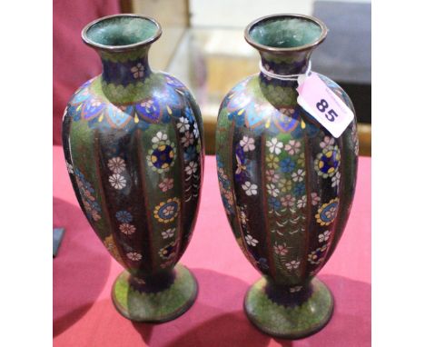 A pair of Japanese cloisonne enamel vases, of lobed inverse baluster form, decorated with flowers and flying insects. Meiji. 