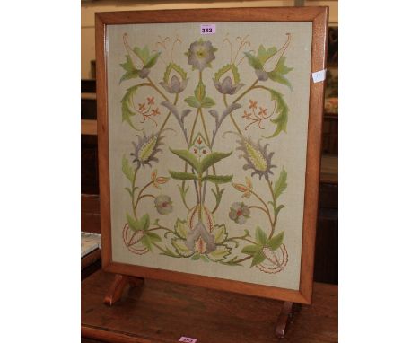 An embroidered firescreen