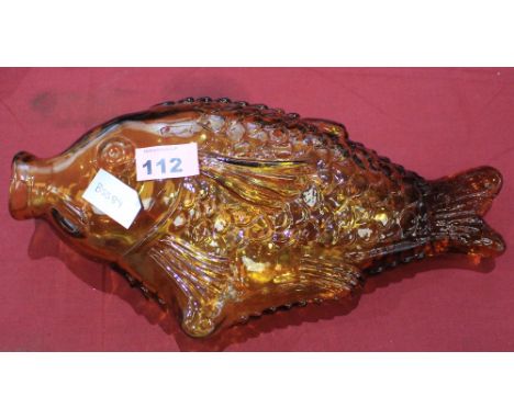A pressed amber glass fish decanter c. 1965. 13' long. C.R. All good