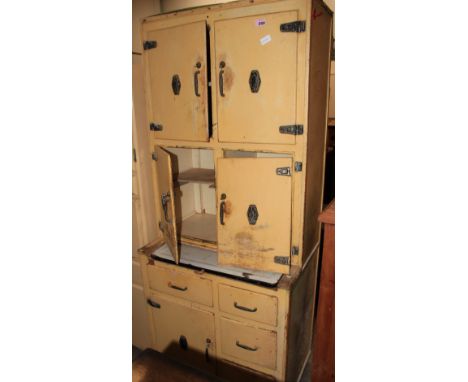 A 1950's kitchen cabinet fitted with an arrangement of cupboards, drawers and a sliding enamel work surface. 74' high