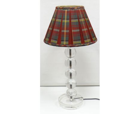 A contemporary clear perspex and chrome table-lamp, the column in the form of five globular knops on a circular platform base