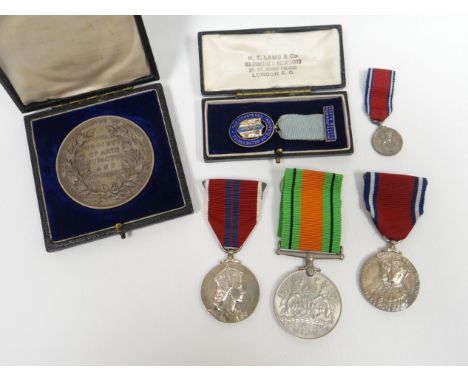 A parcel of medals relating to Mr V F Alban, late of Penarth, comprising 1939-1945 Defence Medal with citation and box, a box