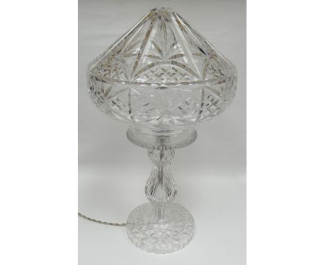 A mid-twentieth century cut-glass mushroom-shaped table lamp with pointed shade, 19ins high (48cms)