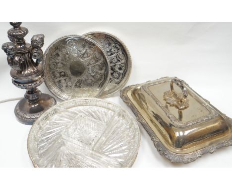 A circular-based EPNS electric table-lamp with figure-head column, an EPNS entree dish, an EPNS and glass segmented hors d'oe