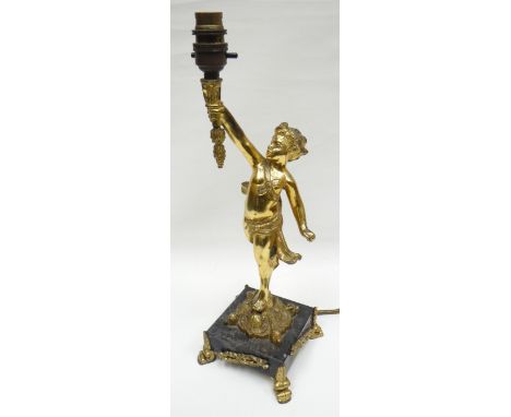 A marble-based gilt-metal torch-bearer cherub table lamp for electric use, on four gilded corner acanthus feet, 15.5ins high 