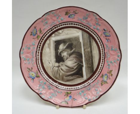 A Nantgarw porcelain plate, the moulded pink border decorated with flowers, ribbons and garlands, the interior with an unusua
