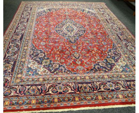 A splendid Persian hand-woven carpet with all-over medallion design, 114 x 180ins (290 x 380cms)