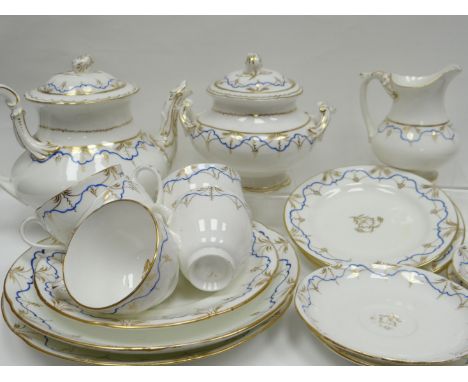 A late nineteenth century Coalport forty-two piece tea-service, decorated in a blue and gilt design