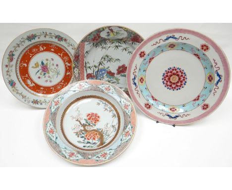 Three nineteenth century tin-glaze plates and a similar dish, all polychrome enamel decorated in the Chinese-taste, approx 9-