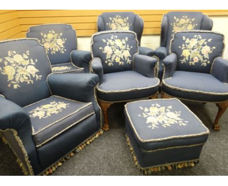 An Edwardian carved and blue wool upholstered, floral tapestry lounge-suite comprising pair of ladies armchairs, pair of gent