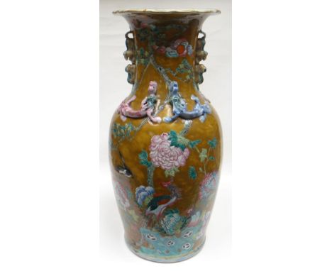 A large circular-based Chinese vase with flared-neck and applied creatures to the upper quarter, the body enamel decorated al