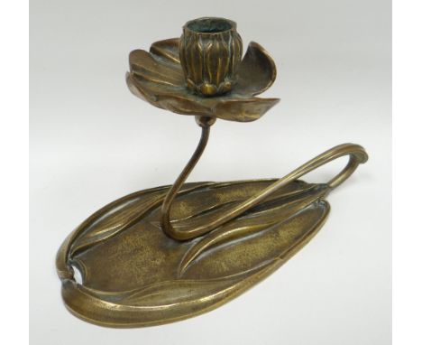 An Art Nouveau polished bronze candlestick holder by Georges De Feure in the naturalistic form of a lily, circa 1900, 8.75ins