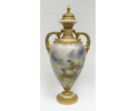 A Royal Worcester covered vase by Harry Davis, shape No.998 having elaborate twin-handles and a circular foot, the cover with