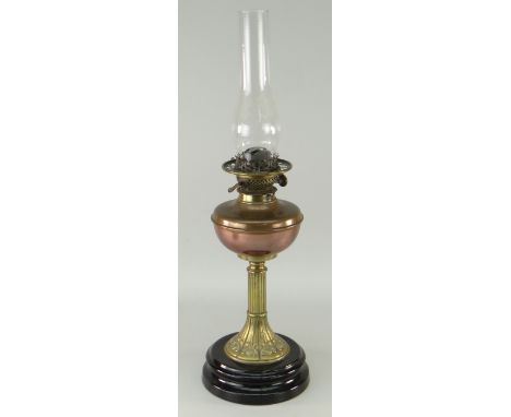 ANTIQUE OIL LAMP WITH ART NOUVEAU STYLE BRASS STEM, circular black glass base, copper reservoir and etched glass globular sha