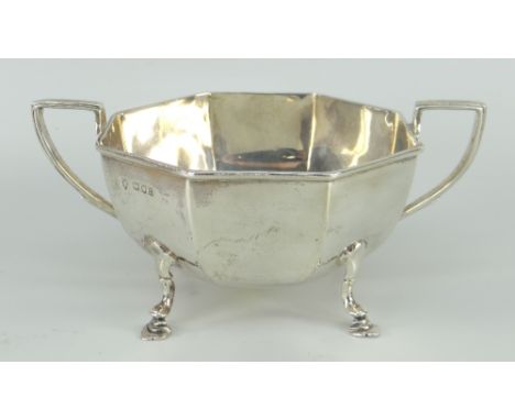 SILVER TWIN-HANDLED SUGAR BASIN of faceted form on hoof feet, London 1918, 8.1ozs