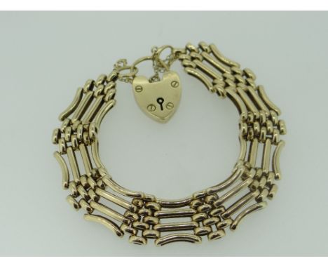 9CT YELLOW GOLD FOUR BAR GATE BRACELET WITH HEART SHAPED PADLOCK, 29.1gms, 20cms long.