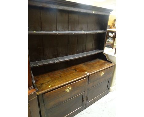 ANTIQUE PRIMITIVE DRESSER having a closed base with two cupboards and two drawers, two shelf boarded rack