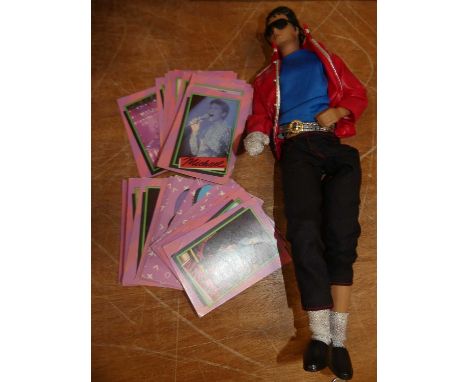 An LJN Toys Ltd vinyl Michael Jackson action figure and a quantity of Michael Jackson collectors' cards