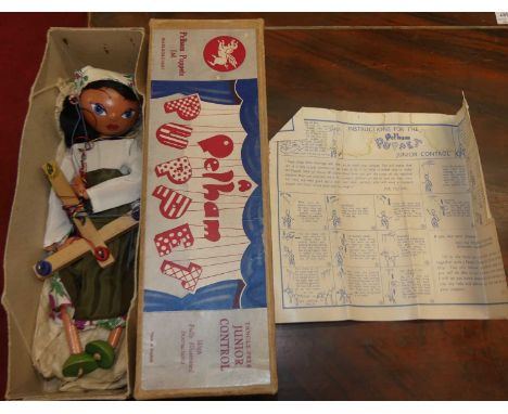 A boxed Pelham Puppet with instruction leaflet and untangle chart