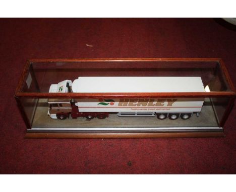 A 1/50 scale white metal kit built model of a Henley ERF 6x4 tractor unit with refrigerated 40' box trailer, housed in glazed