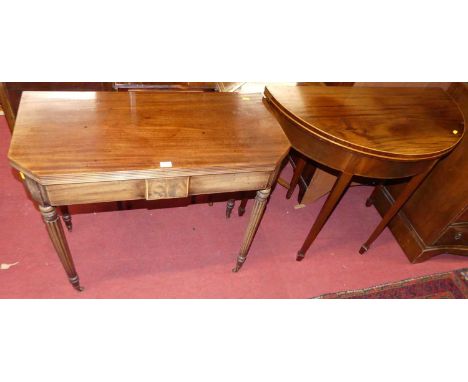 A Regency mahogany fold over tea table having rear gateleg action, reeded edge and ring turned tapering supports, width 84cm,