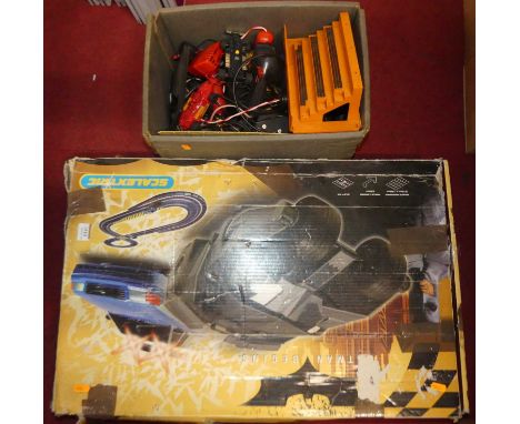 A Scalextric Batman Begins slot racing gift set together with a quantity of associated accessories