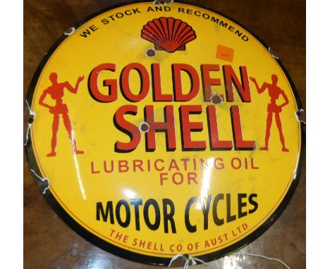 A convex enamel advertising sign for Golden Shell, dia.30cm