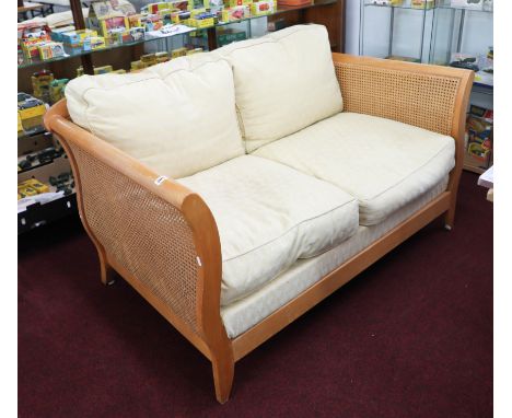 Bergere, a modern light wood, three piece lounge suite, with double cane sides and back.