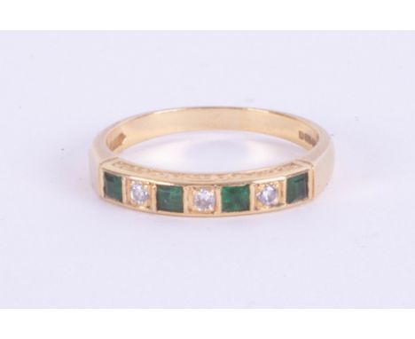 An 18ct emerald and diamond seven stone ring, size P.