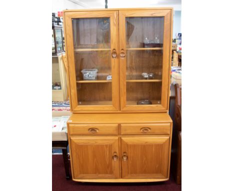 Ercol, a light wood and glazed side cabinet bookcase, width 91cm, height 162cm.