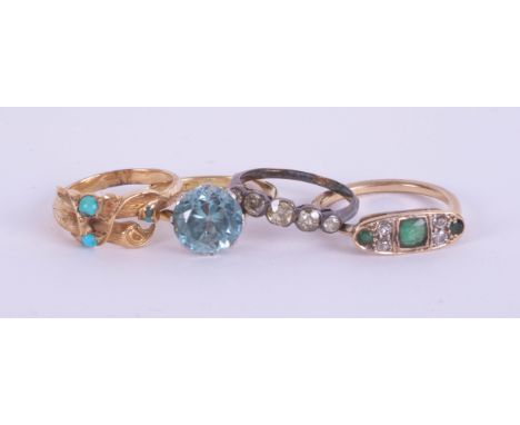 An antique turquoise set ring in yellow gold, unmarked, and three other rings including an 18ct five stone set with old cut d