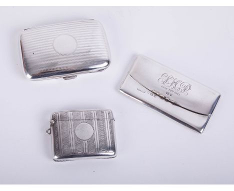 A silver stamp cigarette/cigarette case with monogram marked June 1907, together with a silver and engine turned match vesta 