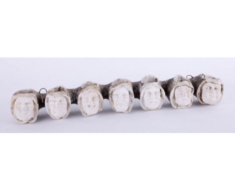 A clay pipe stand in the form of the Seven Deadly Sins, length 28cm.