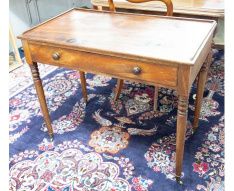 A Victorian mahogany side table with low three quarter gallery, fitted with a single drawer on ring-turned legs, width 91cm.