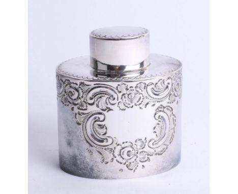 A silver oval tea caddy with lift off top, embossed scroll decorated body, Sheffield maker H.A., height 8.3cm, weight approxi