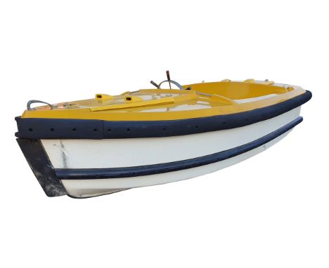 A boating lake motor boat, c.1950/60, of yellow fibreglass mounted with a Stuart Turner R3MC marine engine, serial number 46R