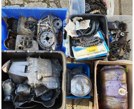 A quantity of motorcycle spares, to included a dismantled engine and a large quantity of chains.