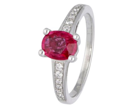 Hallmarks: 750. Set with a faceted natural ruby ​​of approx. 1.03 ct. (approx. 7.3 x 5.8 mm) and 14 brilliant cut diamonds of
