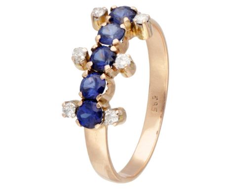 Hallmarks: 585. Set with 6 brilliant cut diamonds of approx. 0.12 ct. in total (P / I-K) and 5 round faceted sapphires (5x Ø 