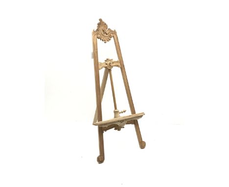 Large hardwood easel, carved scrolls and foliageDimensions: Height: 143cm  Length/Width: 60cm  Depth/Diameter: 68cmClick here