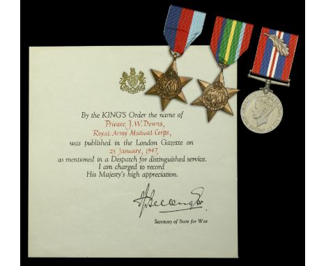 Three: Private J. W. Downs, Royal Army Medical Corps, who was taken Prisoner of War at the Fall of Hong Kong on Christmas Day