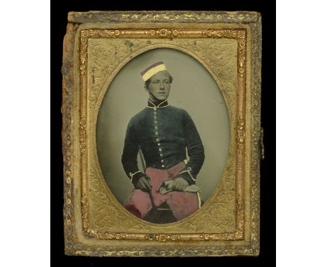 A ninth plate (2 1/2 in x 2 in) tinted ambrotype of a young Hussar of the 11th (Prince Albert’s Own) Huusars, contained in it