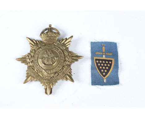 A George V Duke of Cornwall's Light Infantry helmet badge and a Second World War period 73rd Independent Infantry Brigade Cor