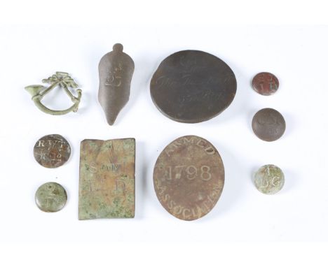 A small collection of late 18th and early 19th century brass plates and fittings, including an oval shoulder belt plate, deta