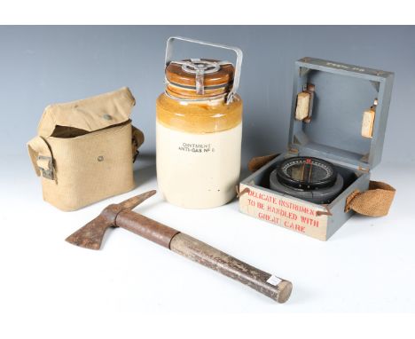 A small group of military-related items, comprising a salt glazed 'Ointment Anti-Gas No. 5' jar, a Defiant air raid warden's 